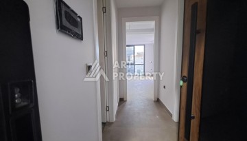 Квартира 1+1 на улице Барбаросса с боковым видом на море в Махмутларе, 55 кв.м. - Ракурс 17