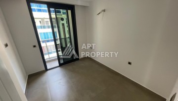 Квартира 1+1 на улице Барбаросса с боковым видом на море в Махмутларе, 55 кв.м. - Ракурс 18