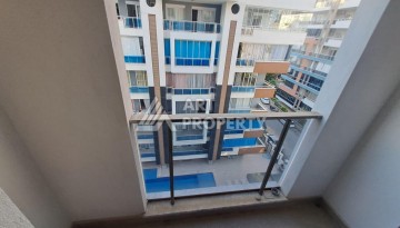 Квартира 1+1 на улице Барбаросса с боковым видом на море в Махмутларе, 55 кв.м. - Ракурс 19