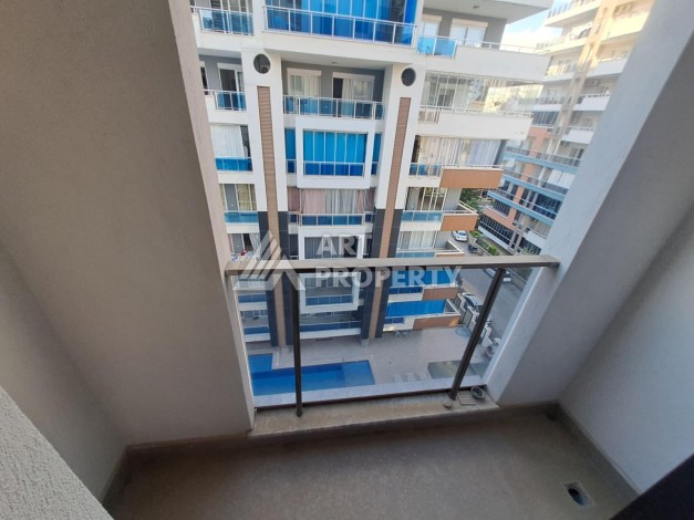 Квартира 1+1 на улице Барбаросса с боковым видом на море в Махмутларе, 55 кв.м. - Ракурс 18