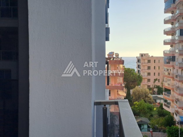 Квартира 1+1 на улице Барбаросса с боковым видом на море в Махмутларе, 55 кв.м. - Ракурс 19