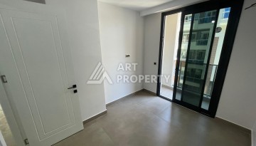 Квартира 1+1 на улице Барбаросса с боковым видом на море в Махмутларе, 55 кв.м. - Ракурс 21