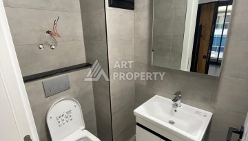 Квартира 1+1 на улице Барбаросса с боковым видом на море в Махмутларе, 55 кв.м. - Ракурс 22