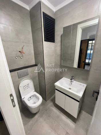 Квартира 1+1 на улице Барбаросса с боковым видом на море в Махмутларе, 55 кв.м. - Ракурс 21