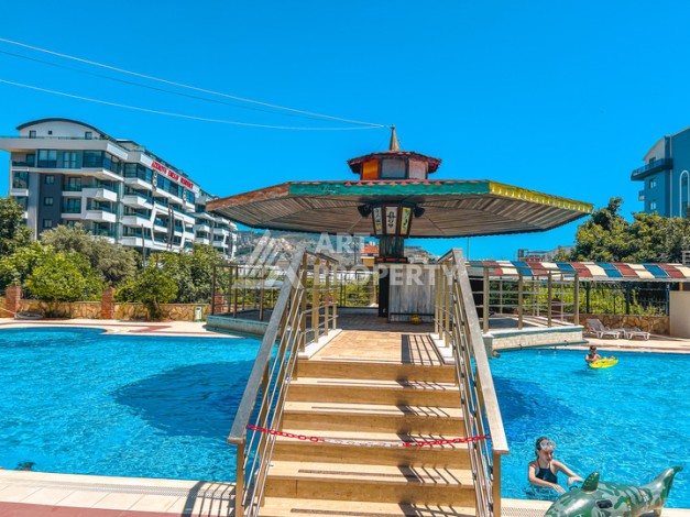 Квартира 2+1 на первой береговой линии в Махмутларе с панорамным видом на море - Ракурс 1