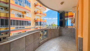 Квартира 2+1 на первой береговой линии в Махмутларе с панорамным видом на море - Ракурс 14