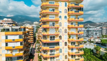 Квартира 2+1 на первой береговой линии в Махмутларе с панорамным видом на море - Ракурс 21