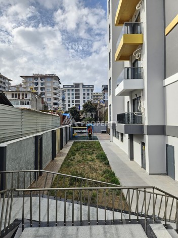 Две квартиры 1+1 с рассрочкой в новом комплексе в Махмутларе — 600 м до моря - Ракурс 6