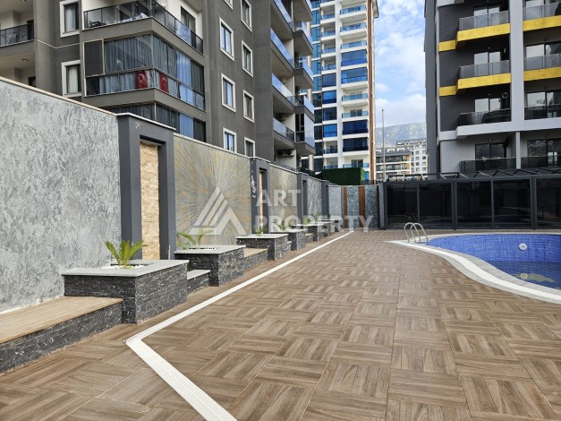 Две квартиры 1+1 с рассрочкой в новом комплексе в Махмутларе — 600 м до моря - Ракурс 12