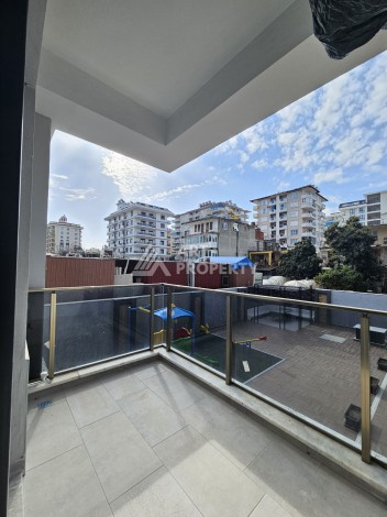 Две квартиры 1+1 с рассрочкой в новом комплексе в Махмутларе — 600 м до моря - Ракурс 26