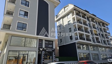 Квартиры 1+1 и дуплексы 2+1 в новом доме в центре Махмутлара. - Ракурс 1