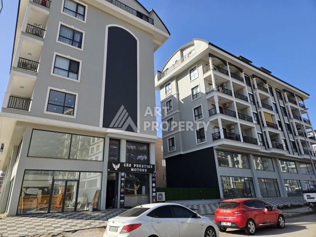 Квартиры 1+1 и дуплексы 2+1 в новом доме в центре Махмутлара. - Ракурс 0