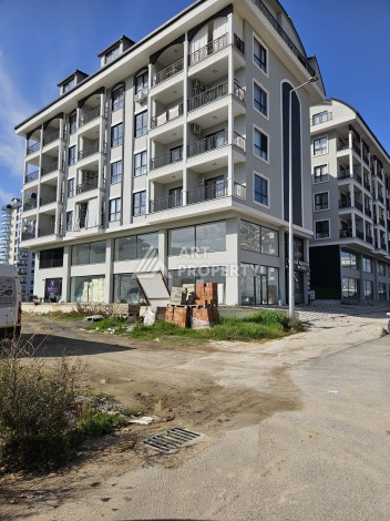 Квартиры 1+1 и дуплексы 2+1 в новом доме в центре Махмутлара. - Ракурс 4