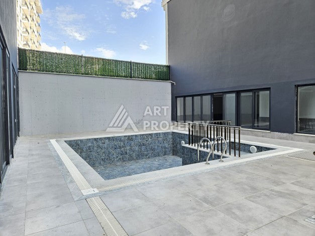 Квартиры 1+1 и дуплексы 2+1 в новом доме в центре Махмутлара. - Ракурс 6