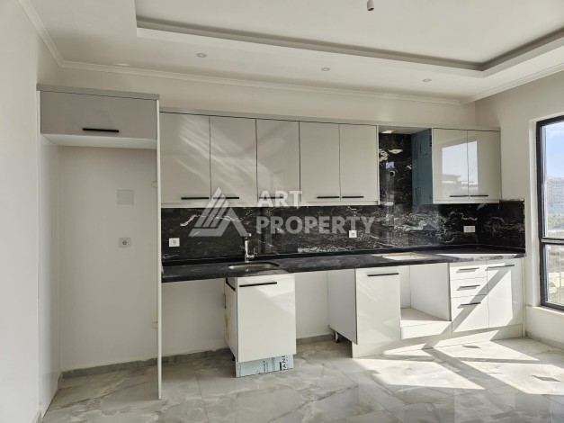 Квартиры 1+1 и дуплексы 2+1 в новом доме в центре Махмутлара. - Ракурс 14