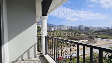 Квартиры 1+1 и дуплексы 2+1 в новом доме в центре Махмутлара. - Ракурс 30