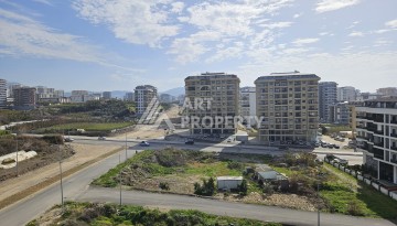 Квартиры 1+1 и дуплексы 2+1 в новом доме в центре Махмутлара. - Ракурс 32