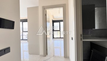 Недорогая квартира 1+1 в новом комплексе в районе Демирташ, 1200 м до моря - Ракурс 2