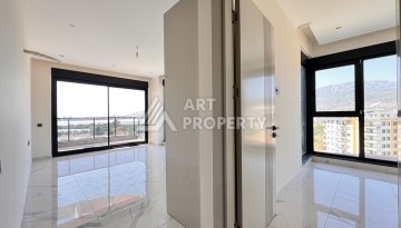 Недорогая квартира 1+1 в новом комплексе в районе Демирташ, 1200 м до моря - Ракурс 3