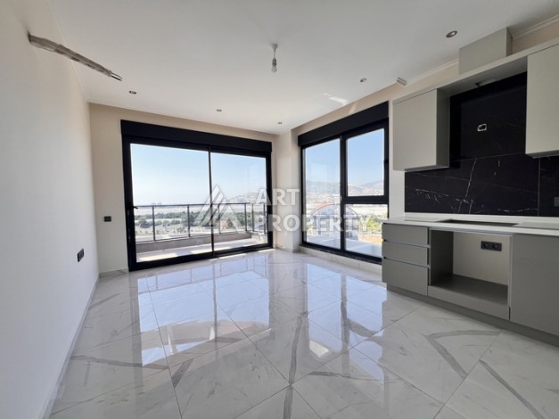 Недорогая квартира 1+1 в новом комплексе в районе Демирташ, 1200 м до моря - Ракурс 3