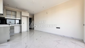 Недорогая квартира 1+1 в новом комплексе в районе Демирташ, 1200 м до моря - Ракурс 7