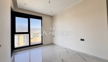 Недорогая квартира 1+1 в новом комплексе в районе Демирташ, 1200 м до моря - Ракурс 9