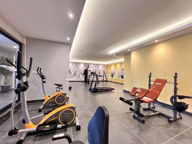 Недорогая квартира 1+1 в новом комплексе в районе Демирташ, 1200 м до моря - Ракурс 10