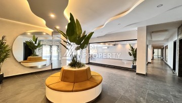 Недорогая квартира 1+1 в новом комплексе в районе Демирташ, 1200 м до моря - Ракурс 14