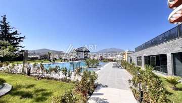 Недорогая квартира 1+1 в новом комплексе в районе Демирташ, 1200 м до моря - Ракурс 29