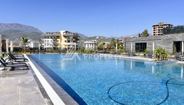 Недорогая квартира 1+1 в новом комплексе в районе Демирташ, 1200 м до моря - Ракурс 30