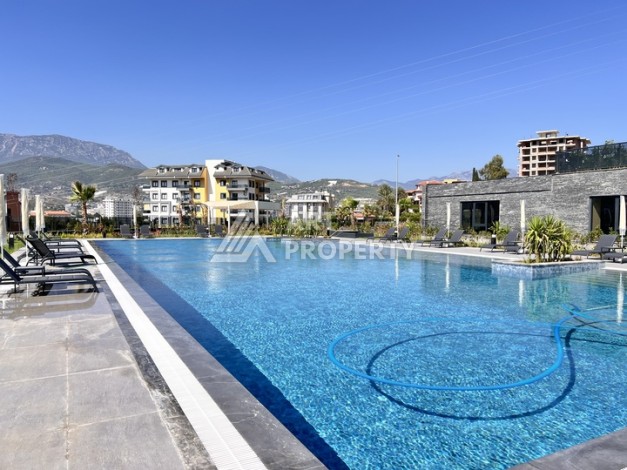 Недорогая квартира 1+1 в новом комплексе в районе Демирташ, 1200 м до моря - Ракурс 29