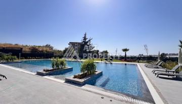 Недорогая квартира 1+1 в новом комплексе в районе Демирташ, 1200 м до моря - Ракурс 34