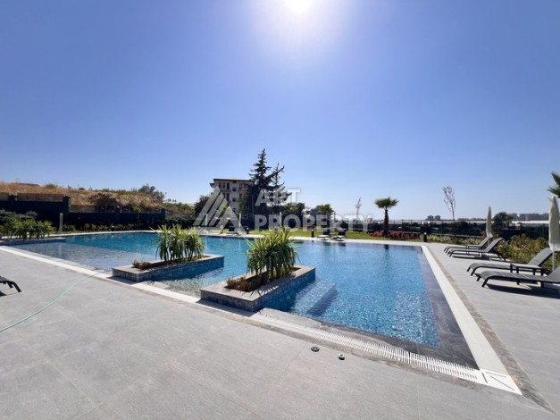 Недорогая квартира 1+1 в новом комплексе в районе Демирташ, 1200 м до моря - Ракурс 33