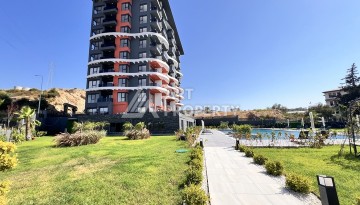 Недорогая квартира 1+1 в новом комплексе в районе Демирташ, 1200 м до моря - Ракурс 36