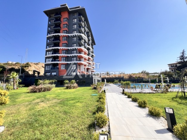 Недорогая квартира 1+1 в новом комплексе в районе Демирташ, 1200 м до моря - Ракурс 35