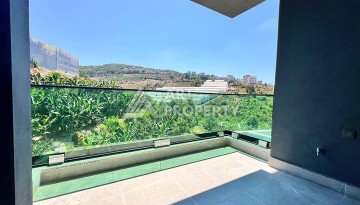 Стильная современная квартира 2+1 в новом комплексе в районе Каргыджак с видами на горы - Ракурс 16