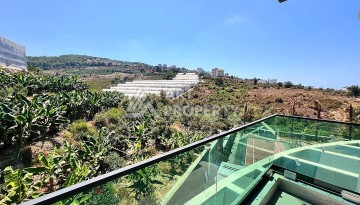 Стильная современная квартира 2+1 в новом комплексе в районе Каргыджак с видами на горы - Ракурс 19