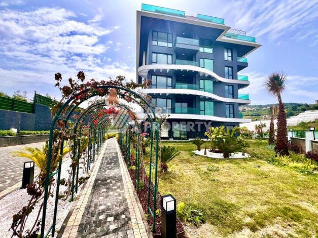 Стильная современная квартира 2+1 в новом комплексе в районе Каргыджак с видами на горы - Ракурс 43