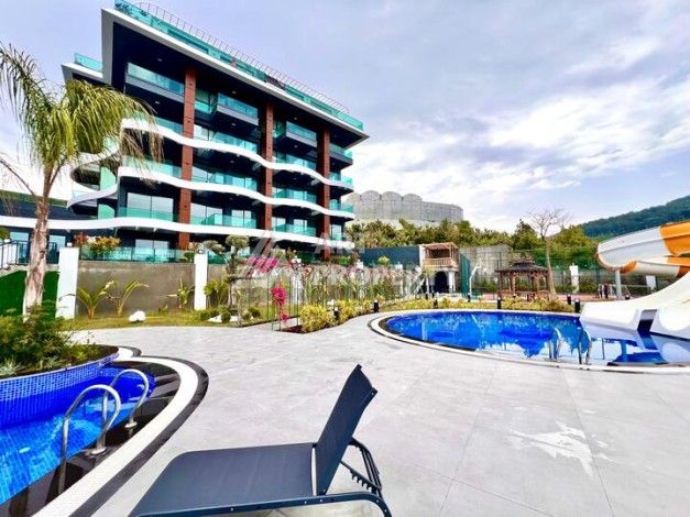 Стильная современная квартира 2+1 в новом комплексе в районе Каргыджак с видами на горы - Ракурс 48