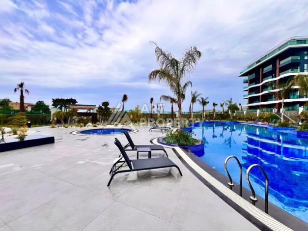 Стильная современная квартира 2+1 в новом комплексе в районе Каргыджак с видами на горы - Ракурс 53