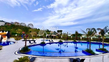 Стильная современная квартира 2+1 в новом комплексе в районе Каргыджак с видами на горы - Ракурс 59