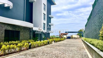 Стильная современная квартира 2+1 в новом комплексе в районе Каргыджак с видами на горы - Ракурс 64