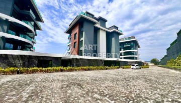 Стильная современная квартира 2+1 в новом комплексе в районе Каргыджак с видами на горы - Ракурс 66