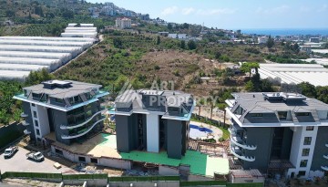 Стильная современная квартира 2+1 в новом комплексе в районе Каргыджак с видами на горы - Ракурс 69