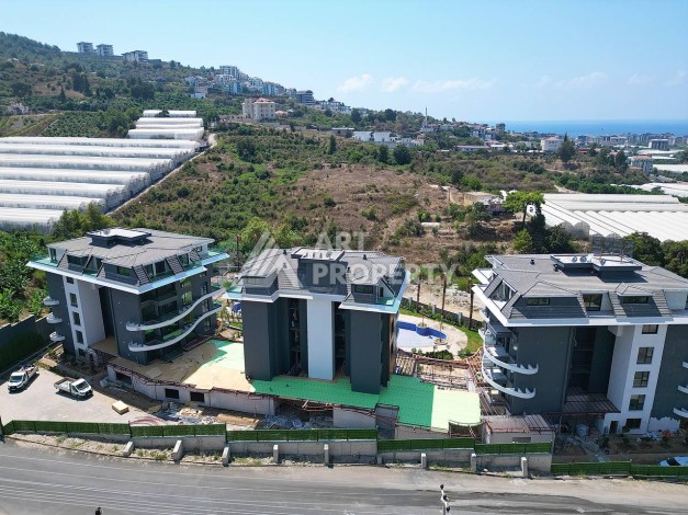 Стильная современная квартира 2+1 в новом комплексе в районе Каргыджак с видами на горы - Ракурс 68