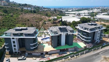 Стильная современная квартира 2+1 в новом комплексе в районе Каргыджак с видами на горы - Ракурс 70