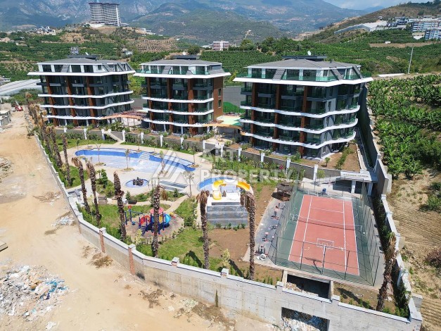 Стильная современная квартира 2+1 в новом комплексе в районе Каргыджак с видами на горы - Ракурс 70