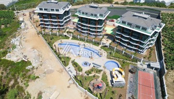 Стильная современная квартира 2+1 в новом комплексе в районе Каргыджак с видами на горы - Ракурс 72