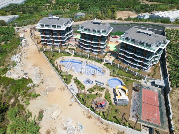 Стильная современная квартира 2+1 в новом комплексе в районе Каргыджак с видами на горы - Ракурс 71