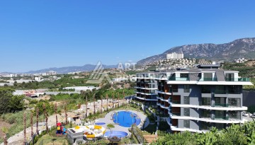 Стильная современная квартира 2+1 в новом комплексе в районе Каргыджак с видами на горы - Ракурс 73